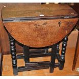 A small 19th century oak drop-leaf occasional table, with gateleg action on bobbin turned