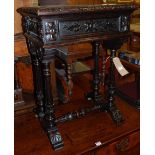 A circa 1900 ebonised and relief carved oak hinge top workbox, raised on fluted and acanthus leaf