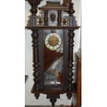 An early 20th century walnut Vienna droptrunk wall clock, with pendulum and key, approx h.95cm