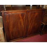 A 19th century mahogany double door side cupboard, the interior fitted with drawers and adjustable