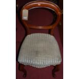 A set of four mid-Victorian mahogany balloon back dining chairs, raised on cabriole forelegs (some