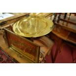 An Eastern engraved circular brass topped occasional table, together with a further Eastern engraved