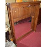 An early 20th century Belgian panelled oak and bevelled overmantel mirror, 139 x 120cm