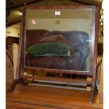 A 19th century mahogany swing dressing mirror raised in a reeded frame, width 53cm