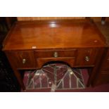 A 19th century mahogany three-quarter gallery backed three-drawer side table raised on square