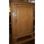 A late Victorian pine ledgeback low single door corner cupboard, h.101.5cm
