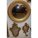 A contemporary circular gilt decorated ropetwist convex wall mirror, dia.45cm; together with a