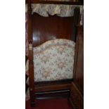 A circa 1900 mahogany double full tester bed, having applied floral upholstered headboard with