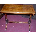 A Victorian walnut and figured walnut round cornered hall table, raised on turned and leaf capped