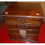 An Edwardian mahogany table top chest of four drawers, width 33cm