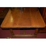 A Victorian style stained pine round cornered farmhouse kitchen table, raised on turned and square