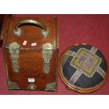 A late Victorian walnut and brass bound coal purdonium; together with a low circular tapestry
