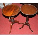 A contemporary mahogany circular pedestal wine table; together with one other similar example (2)