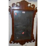 A circa 1900 mahogany Chippendale style fret carved wall mirror, 64 x 37cm