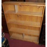 A modern pine round cornered open bookshelf, width 99cm