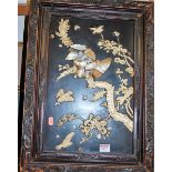 A Japanese Meiji period bone and mother of pearl shibyama panel, depicting bird of prey amidst