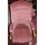 A pair of mid-Victorian and pink buttoned upholstered oak framed open armchairs, raised on turned