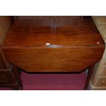 An early 19th century mahogany Pembroke table, having single end drawer on square tapering supports,