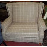 A contemporary chequer upholstered and studded twin wingback sofa, width 110cm