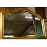 A modern gilt composition framed wall mirror, w.105cm