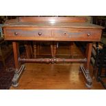 A Victorian mahogany gallery backed round cornered two-drawer hall table (lacking one side of