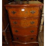 A reproduction figured walnut and crossbanded serpentine front chest of four long drawers, width