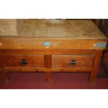 A good early 20th century pine butcher's block on stand, the removable top with metal bound