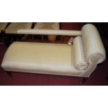 An Edwardian mahogany framed cream floral upholstered daybed of small proportions, length