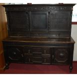 An early 20th century Jacobean carved and moulded oak dresser, width 182cm