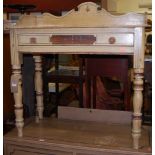 A Victorian painted pine three-quarter gallery back single drawer wash stand, raised on turned