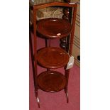 A 1930s mahogany and boxwood strung circular three-tier folding cake stand