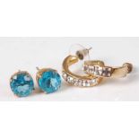 A pair of gilt metal and blue stone set ear studs together with a pair of gilt metal and CZ set