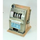 A novelty table-top moneybox in the form of a fruit machine