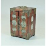 A Chinese hardwood and brass bound double door table cabinet, enclosing four drawers, the doors each