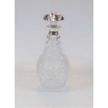 A William IV style cut glass triple ringneck mallet decanter and stopper, having a silver collar,