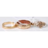An 18ct gold wedding band 2.7g, together with a 9ct gold wedding band and a 9ct gold dress ring, 6.