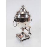 A Regency silver plated samovar, having twin lion mask ring handles and ivory mounted spigot, on