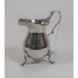 A silver helmet form cream jug in the George II style, 3oz, maker SB&S Ltd, Birmingham assays,