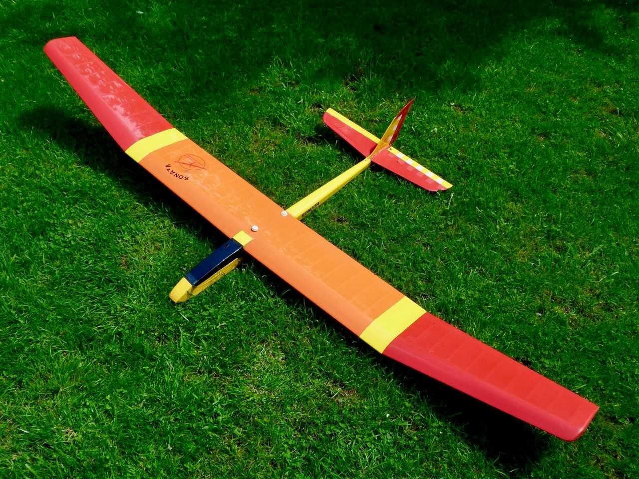 A kit built (For Radio Controlled) Glider Aircraft, comprising of 2 sections finished yellow/orange,