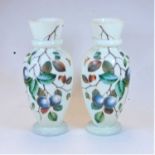 A pair of Victorian opalescent glass vases of baluster form, each overlaid with butterflies and