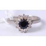 An 18ct white gold, blue & white sapphire flowerhead cluster ring, 5.1g, size P