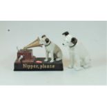 A reproduction HMV Nipper Please novelty moneybox, together with a modern ceramic model of Nipper (