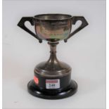 A George V silver twin handled pedestal trophy cup with engraved presentation inscription, 5.5oz,