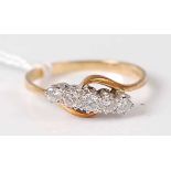 An 18ct gold diamond five stone ring, the five round cut diamonds in a line setting weighing