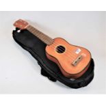 A modern Lazy ukelele, in soft carry case