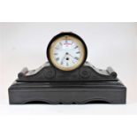 A late Victorian black slate cased drumhead mantel clock, having an enamelled dial with Roman