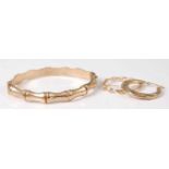 A 9ct gold simulated bamboo hinge bangle, 9.6g, dia. 67mm, together with two modern hollow 9ct