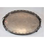 A Victorian silver plated twin handled oval gallery tray with floral engraved decoration, width