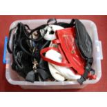 A collection of ladies handbags to include red & black leather examples