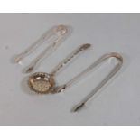 A pair of 19th century silver sugar tongs; together with a pair of plated sugar tongs, and a